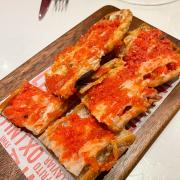 Toasted slices of crispy Spanish ‘cristal’ bread brushed with fresh tomato