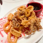 Crispy-fried squid served with squid ink alioli 